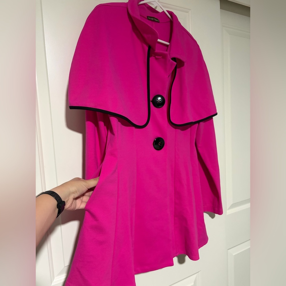 Design Today’s Vibrant Pink Cape Coat with Black Trim - Picture 3 of 7